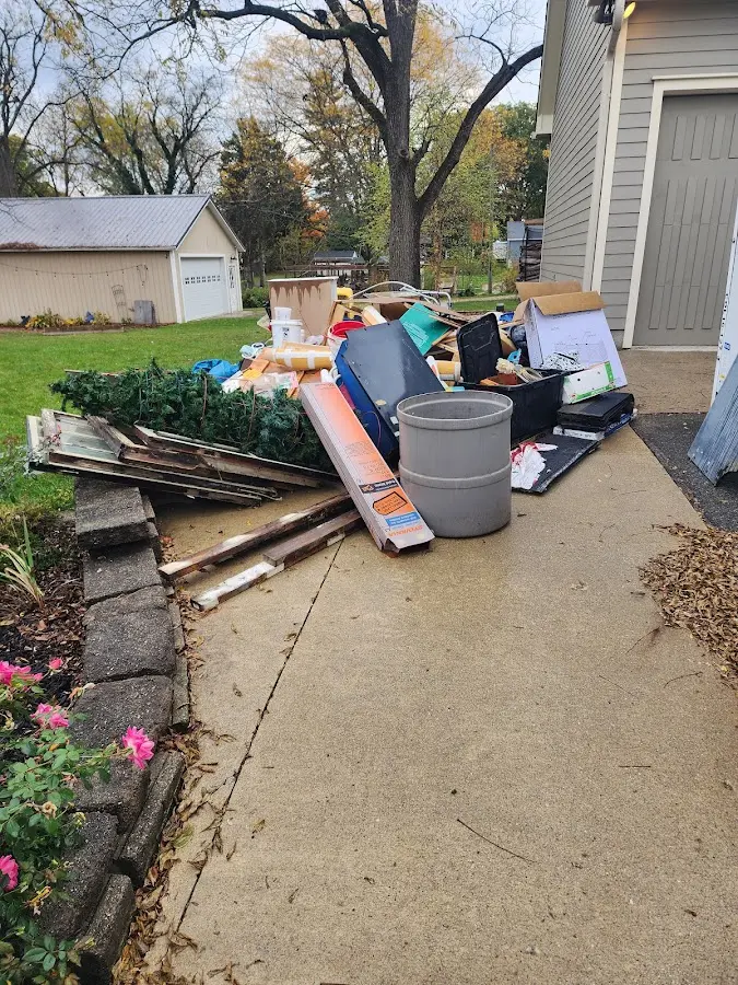 Dumpster being loaded with debris for Demolition Dumpster Rental in Lake Tansi